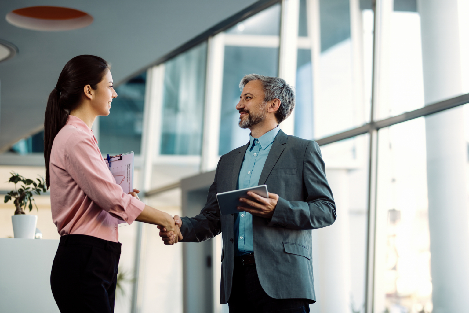 Colleagues shaking hands after a business meeting