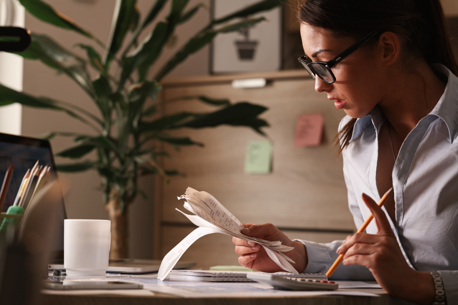 Accountant working through figures at her desk