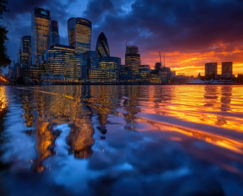 Aml supervision report City of london financial district skyline lit at dusk, reflected in the river thames
