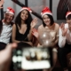 Accountingcpd Colleagues in santa hats waving at a staff christmas party